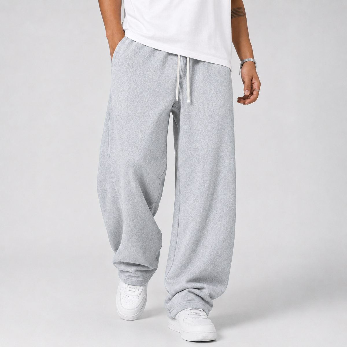 Pantalon jogging homme gris clair coupe large avec cordon de serrage, vue de face
