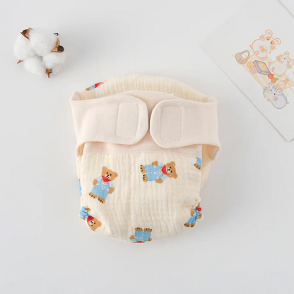 Body bébé plié à plat, motif ourson en tenue bleue