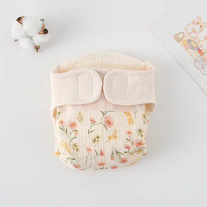 Body bébé plié à plat, motif fleurs sauvages roses et jaunes