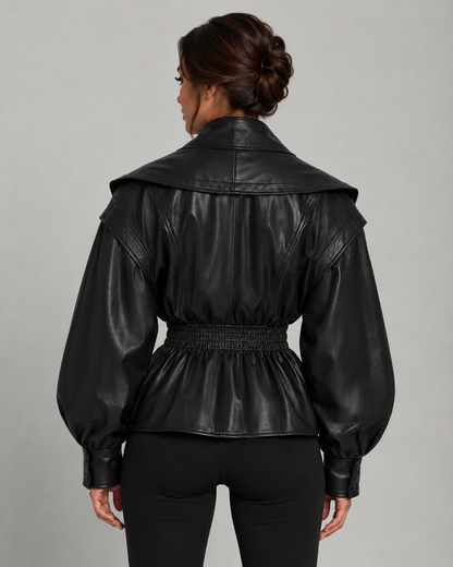 Dos de la veste peplum femme noire, taille froncée élastique et basque évasée