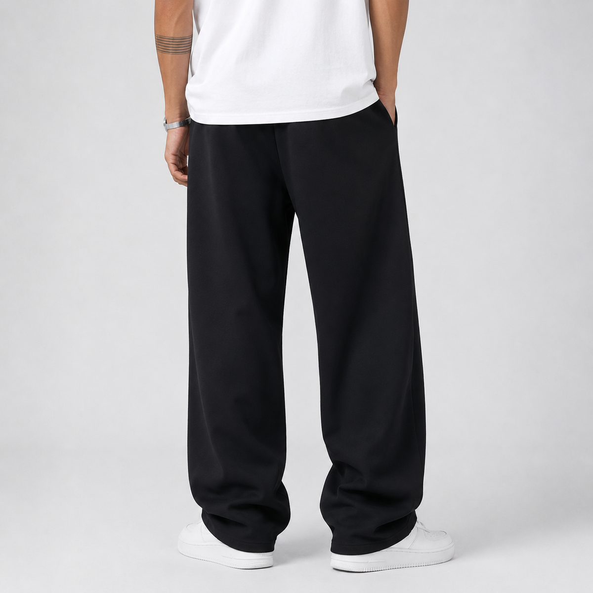 Pantalon jogging homme noir coupe large, vue de dos