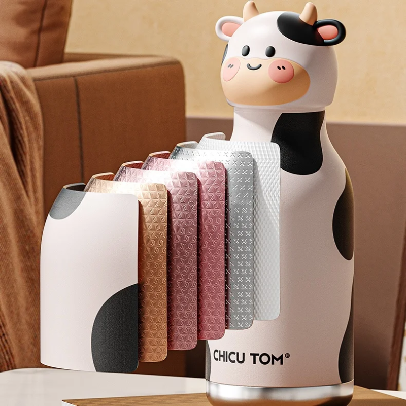 Gourde design vache avec un éventail d'échantillons de tissu montrant les finitions de housse disponibles