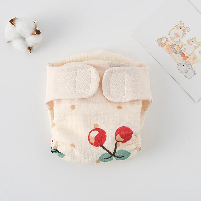 Body bébé plié à plat, motif cerise et pois