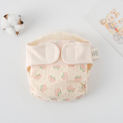 Body bébé plié à plat, motif floral rose pâle