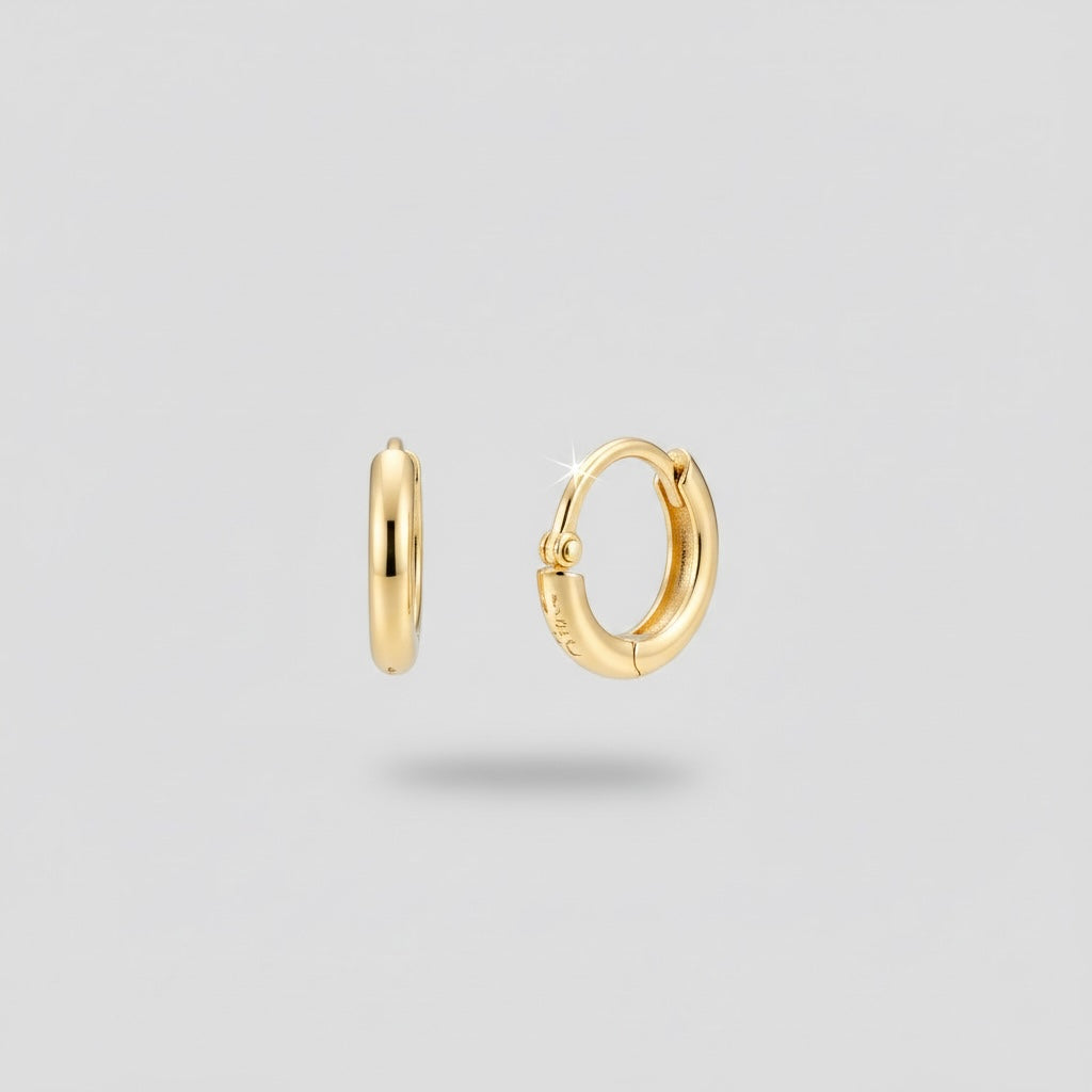 boucles d'oreilles créoles dorées, vue portée