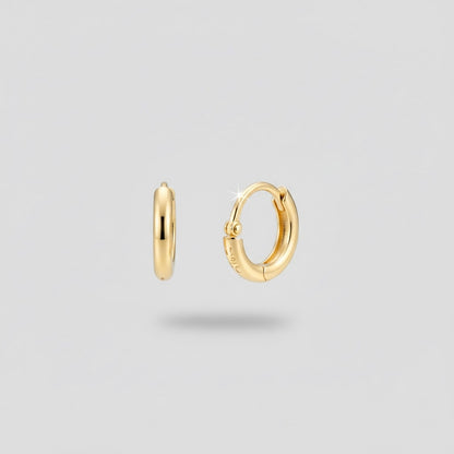 boucles d'oreilles créoles dorées, vue portée
