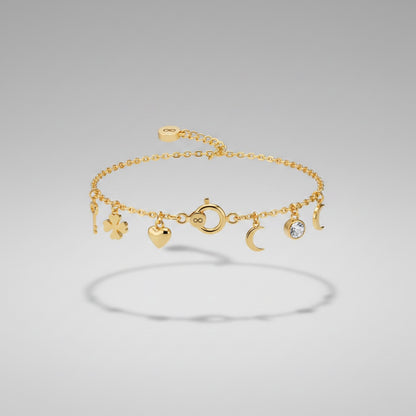 Pulsera con dijes de oro