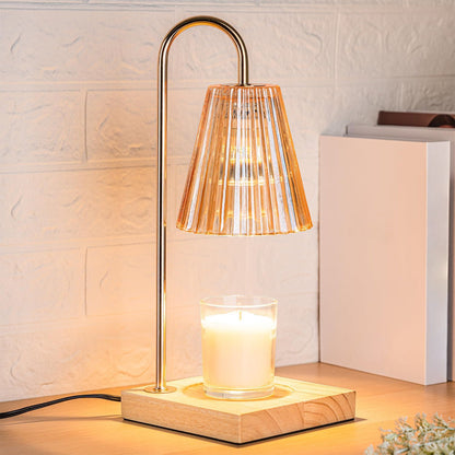 Lampe chauffe-bougie couleur ambre, structure dorée et socle en bois