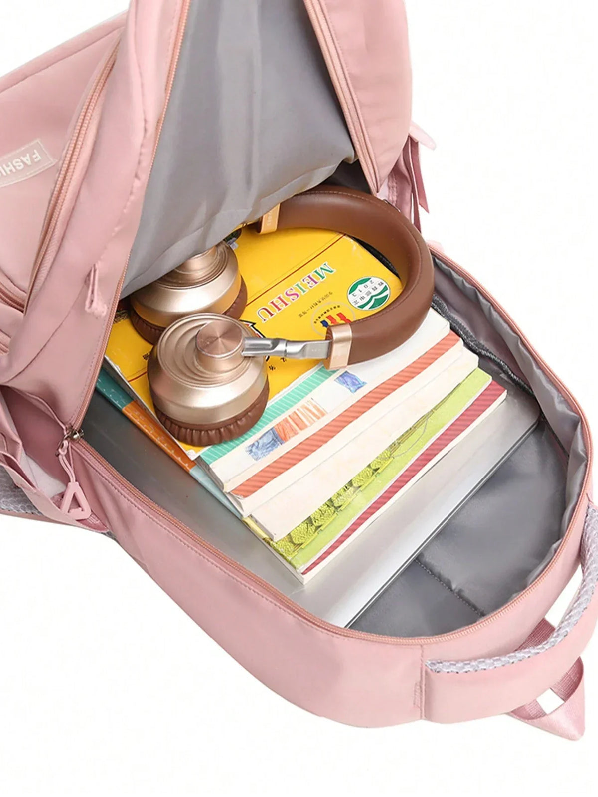 Vue de profil du sac à dos scolaire rose
