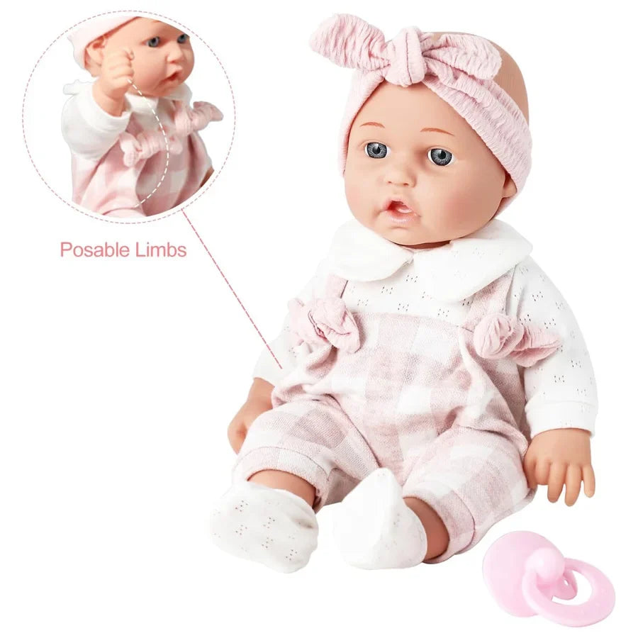Poupon doux avec headband rose et tétine, en pyjama