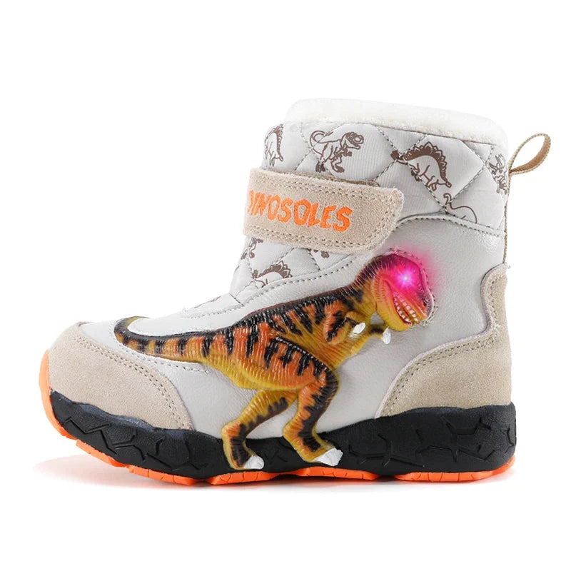 Bottes de neige enfant lumineuses LED beiges motif dinosaure, vue studio