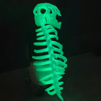 Coiffe squelette de dinosaure phosphorescente, vue de dos avec colonne vertébrale