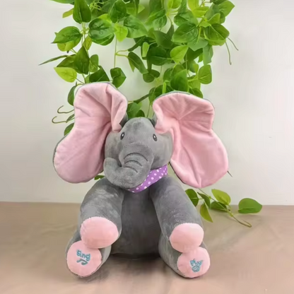 Éléphant peluche coucou interactif, en plein jeu de coucou