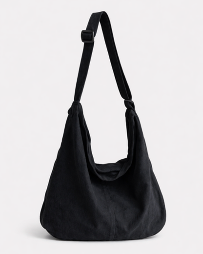 Sac hobo femme en cuir souple, bandoulière réglable, détail finition