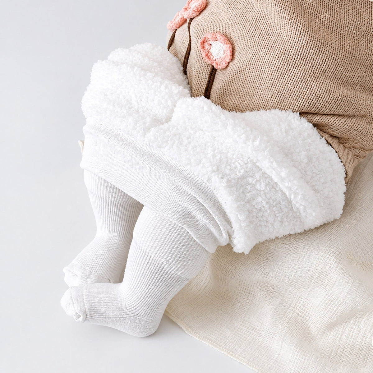 Collants thermiques enfant côtelés blancs doublés polaire avec pieds intégrés, vue de face à plat