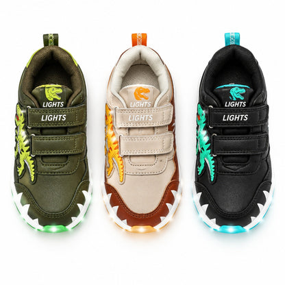 Vue à plat des baskets enfant lumineuses LED dinosaure dans les coloris vert kaki, beige et noir