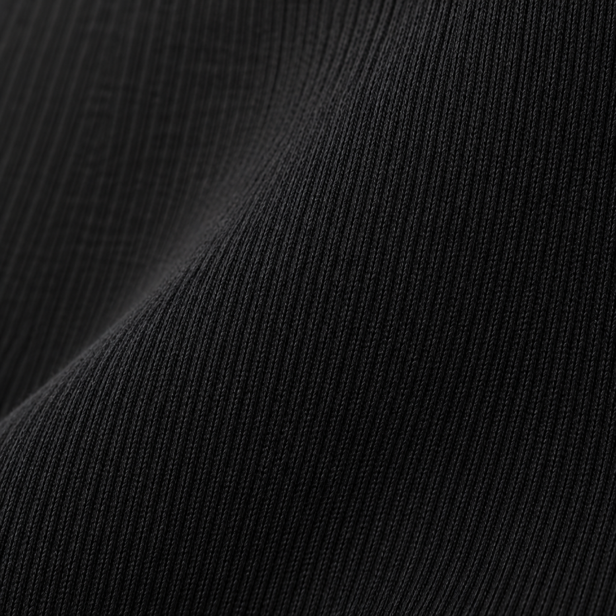 Gros plan sur la texture du tissu côtelé du legging maternité Melvoire