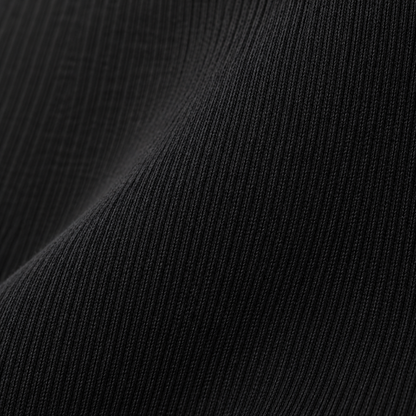 Gros plan sur la texture du tissu côtelé du legging maternité Melvoire