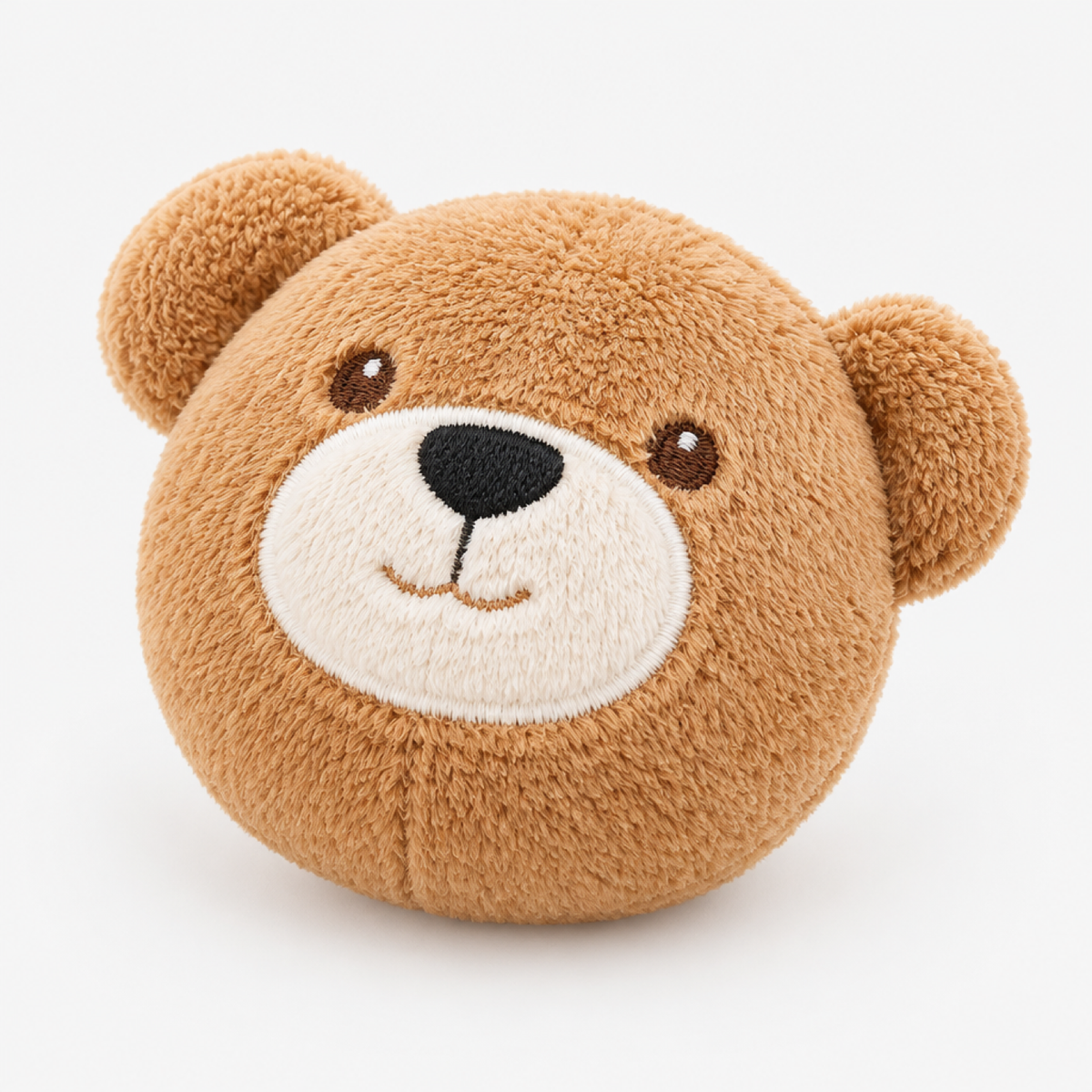 Gros plan sur le hochet en peluche en forme de visage d'ours inclus avec la grange sensorielle