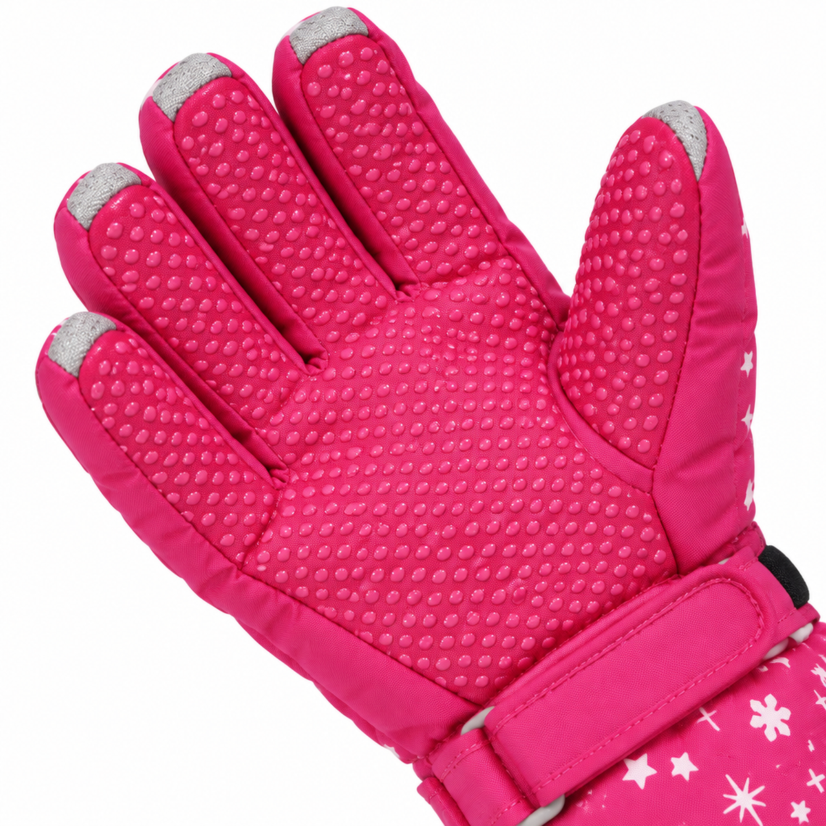 Gros plan sur le motif antidérapant en silicone texturé sur la paume du gant de ski rose rouge pour fille