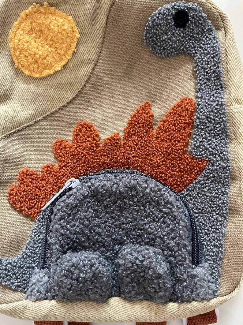 Vue arrière du sac à dos dinosaure avec bretelles rembourrées