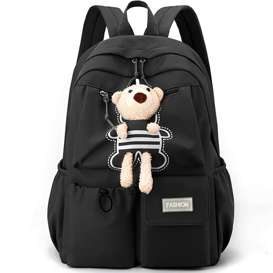 Sac à dos scolaire enfant noir avec porte-clés ourson en peluche, vue de face