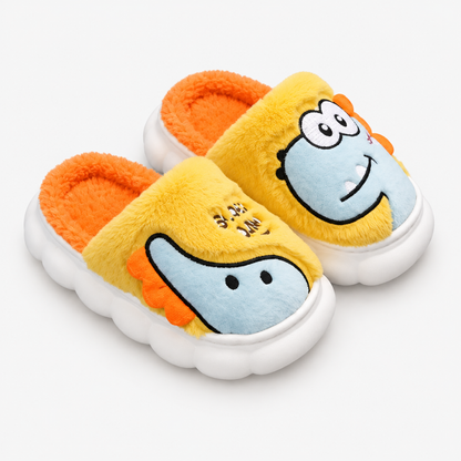 Chausson monstre jaune en peluche, vue de côté montrant la semelle et la doublure moelleuse