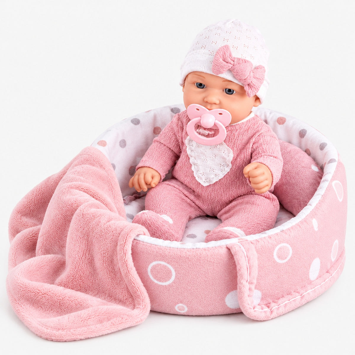 Poupon 30 cm en grenouillère rose avec tétine, dans son panier à pois avec couverture polaire rose