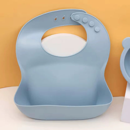 Bavoir en silicone avec poche récupératrice pour bébé