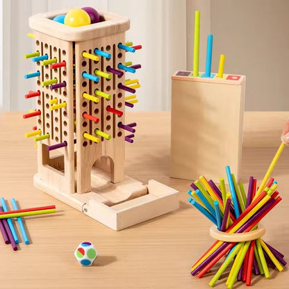 Enfant empilant les blocs de la tour en bois pendant le jeu